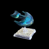 Model spaceship on a stand with a black background