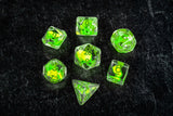 Set of green dice with numbers on a black background