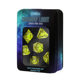 Set of yellow dice in a 'Shadow Light' packaging with black lid
