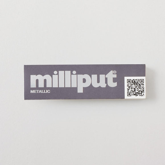 Box of milliput metallic putty with a QR code on a light gray background