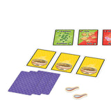 Card game components including cards with food items and purple scoring pads on a white background