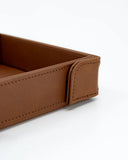 Brown leather tray on a white background
