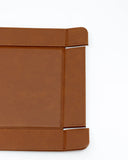 Close-up of a brown leather product on a white background