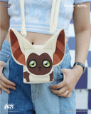 Crossbody bag shaped like a cartoon character with a person wearing it.