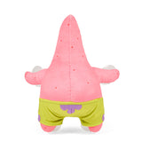 Pink plush toy with green shorts on a white background