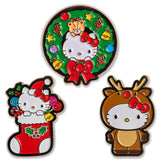 Three Christmas-themed Hello Kitty pins on a white background