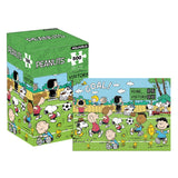 Peanuts-themed puzzle box with cartoon characters playing soccer on a white background