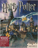 Harry Potter 1000-piece jigsaw puzzle box by Aquarius, featuring Hogwarts castle and an owl carrying a golden ticket under the Harry Potter logo.