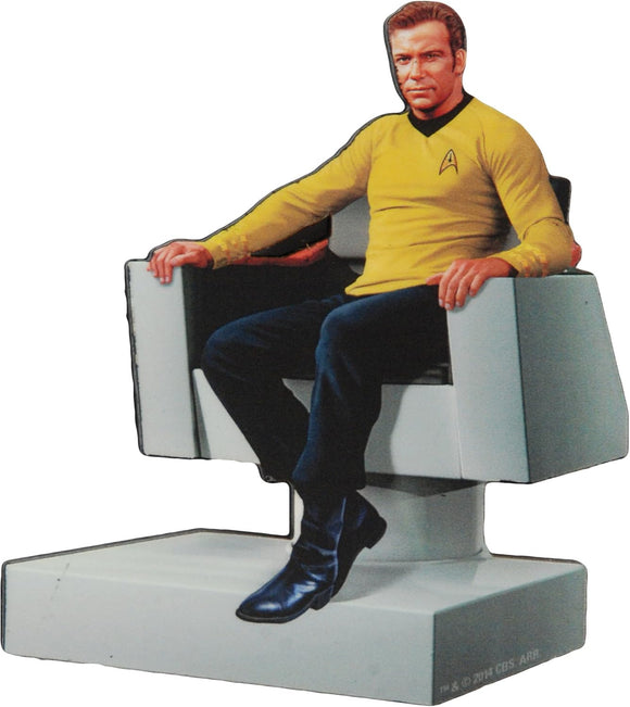 Figure of a character in a yellow shirt sitting on a chair with a white background