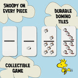 Domino tiles with Snoopy design on a blue background