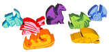 Set of colorful dragon-shaped toys on a white background