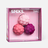 Speks product packaging with pink, red, and purple speks on a white background