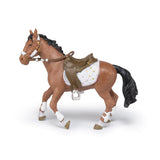 Model horse with a saddle on a white background