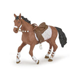 Model horse with a saddle and bridle on a white background