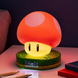 Mushroom-shaped night light with digital clock on a table