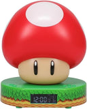 Red mushroom-shaped clock with a digital display on a white background