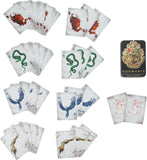 A set of Harry Potter themed playing cards with various animal and character illustrations, shown alongside a black Hogwarts box on a plain white background.