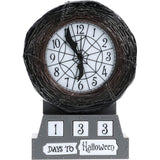 Halloween-themed countdown clock with a dark woven wreath frame, spiderweb design on the white face, and a gray base displaying '1 3 3 DAYS TO Halloween'.