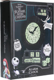 Disney Tim Burton's The Nightmare Before Christmas alarm clock in its original retail packaging. The box features illustrations of Jack Skellington and Sally, showcasing the black clock face with glowing green numbers and hands, along with digital date-change blocks.