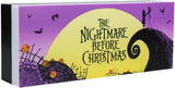 A rectangular decorative box featuring the 'The Nightmare Before Christmas' artwork, with a purple sky, large yellow moon, black spiral hill, bats, pumpkins, and the title text on the front.