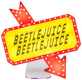 Neon sign with 'Beetlejuice' text in a retro style on a white background
