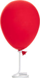 Red balloon with a white stick on a white background