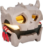 Decorative skull-shaped lantern with glowing interior on a white background