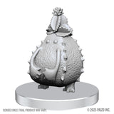 White plastic figurine with spiky texture on a white background