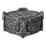 Decorative metal box with intricate designs on a white background