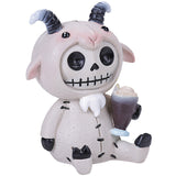 Skeleton goat figurine holding a cupcake on a white background