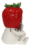Figurine of a hand holding a strawberry with a white background