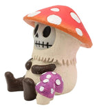 Skeleton figurine with red mushroom hat and purple mushroom body on a white background