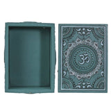 Teal box with decorative Om symbol on a white background