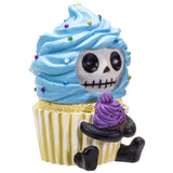 Cupcake with blue frosting and a skeleton character holding a smaller purple cupcake on a white background