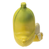 Yellow and green ceramic vase with a small white flower on a white background