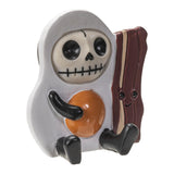 Skeleton character holding a book and an egg on a white background
