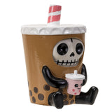 Skeleton character holding a small pink cup with a straw on a white background