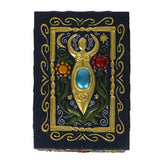 Decorative box with gold embellishments and gemstones on a black background