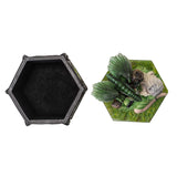 Hexagonal black container with a green lid featuring a fantasy design on a white background