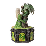 Statue of a woman embracing a dragon with a gothic-style base on a white background