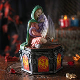 Statue of a woman with a child on a dark background