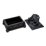 Decorative black dragon box with intricate designs on a white background