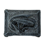 Decorative metal box with a dragon design on a white background