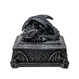 Decorative dragon figurine on a pedestal with intricate designs