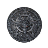 Decorative plate with a dragon design and pentagram symbol on a white background