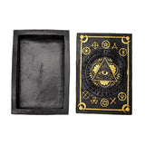 Black inkstone with gold symbols on a white background