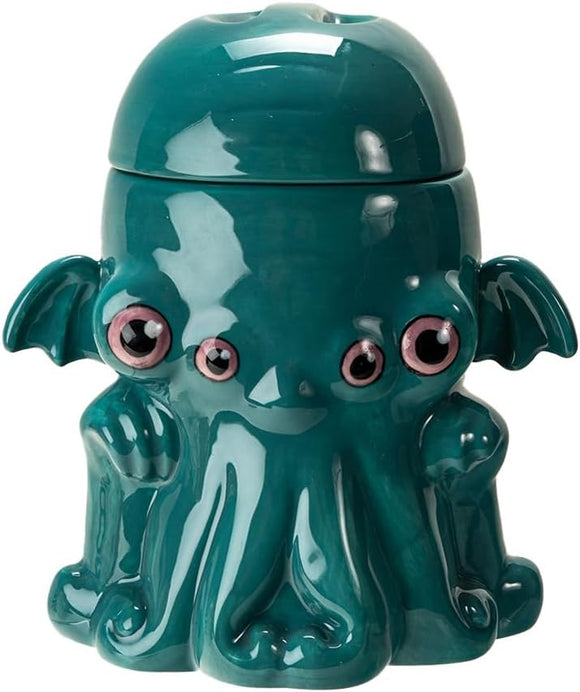 Teal octopus-shaped container with a lid on a white background