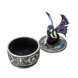 Decorative box with a fairy figurine on a white background