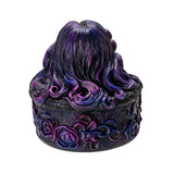 Decorative box with wavy purple and black hair on a white background