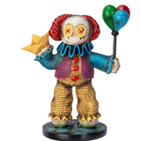 Colorful clown figurine holding balloons and a star on a white background